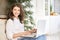 Girl with computer. Sitting kitchen