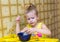 girl concentrating dunk the bread in a cup