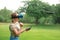 The girl controls a quadrocopter in the park with the help of a VR helmet. The concept of virtual reality. extra reality