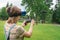 The girl controls a quadrocopter in the park with the help of a VR helmet. The concept of virtual reality. extra reality