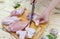 Girl cook butchering a chicken thigh. Parts of a chicken carcass on a cutting Board