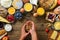 Girl cooking breakfast - granola with yogurt, fruits, berries, milk, yogurt, juice, cheese. Top view, copy space. Clean