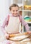 Girl cooking in home kitchen, making dough, healthy food concept