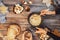 Girl cooks gourmet Swiss fondue dinner with cheese on fire, autumn wooden background with maple leaves. Top view, flat