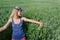 Girl cornflower crown on head resting in meadow