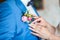 Girl corrects bride groom boutonniere. flowers Advertising.Wedding. Bride corrects groom boutonniere at their wedding. Close-up d