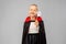 Girl in costume of dracula with cape on halloween