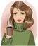 Girl in cozy green sweater holding a hot mug