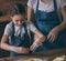 Girl cracking egg to dough