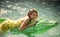 Girl on the crocodile. woman on sea with inflatable mattress. Relax in luxury swimming pool. Fashion crocodile