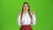 Girl crossed her fingers. Green screen