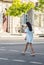 Girl crossing the road. Street