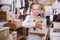 Girl with curbstone in furniture store