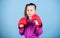 Girl cute boxer on blue background. With great power comes great responsibility. Contrary to stereotype. Boxer child in