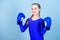 Girl cute boxer on blue background. Rise of women boxers. Female boxer change attitudes within sport. Feminism concept