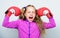 Girl cute child with red gloves posing on white background. Upbringing for leader. Strong child boxing. Sport and health