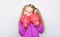 Girl cute child with red gloves posing on white background. Upbringing for leader. Strong child boxing. Sport and health