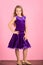 Girl cute child wear velvet violet dress. Clothes for ballroom dance. Ballroom dancewear fashion concept. Kid dancer