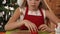 Girl cutting christmas cookie shapes from gingerbread dough