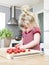 Girl cutting tomatoes
