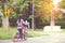 Girl is cycling in the park, bicycle stops at traffic lights