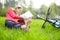 Girl cyclist on a halt reads lying in fresh green