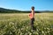 Girl in daisy wheel spring flower field