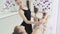 Girl dancer in ballet school learns to dance. Graceful girls in tutus dance the ballet against of a panoramic window in