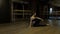 Girl dancer with ponytail in black tights demonstrates body flexibility doing exercise coup back on floor slow motion