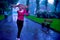 Girl dancing and shaking the hair under the rain.