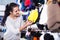 Girl deciding on warm hat in sports store