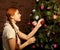 Girl decorate the Christmas tree