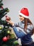 Girl decorating Christmas tree