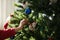 Girl decorating a Christmas tree