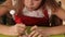 Girl decorating gingerbread christmas cookies