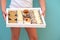 Girl Delivering The Diverse Sweets In A Tray To The Table.