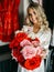 Girl demonstrates a bouquet of red roses, selective focus.