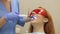 Girl at the dentist, dentist doctor shines with an ultraviolet lamp on her teeth