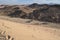 Girl and Desert, mountains, sand on a sunny day