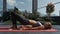 Girl does exercise lifting pelvis lying on terrace