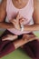 A girl does mudra yoga out of her hands.