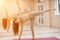 Girl does yoga. Young woman practices asanas on a beige one-ton background.