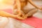 Girl does yoga. Young woman practices asanas on a beige one-ton background.