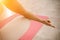 Girl does yoga. Young woman practices asanas on a beige one-ton background.