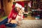 Girl with dog taking Christmas selfie