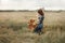 Girl with dogs in the field.