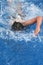 Girl doing a breaststroke in pool