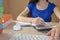 Girl doing her homework. School books on desk, education concept. Young Girl doing lessons at home