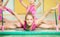 Girl doing rhythmic gymnastics with Indian clubs