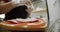 Girl doing sandwich with salami. Puts sausage on bread. Slow motion. Close up